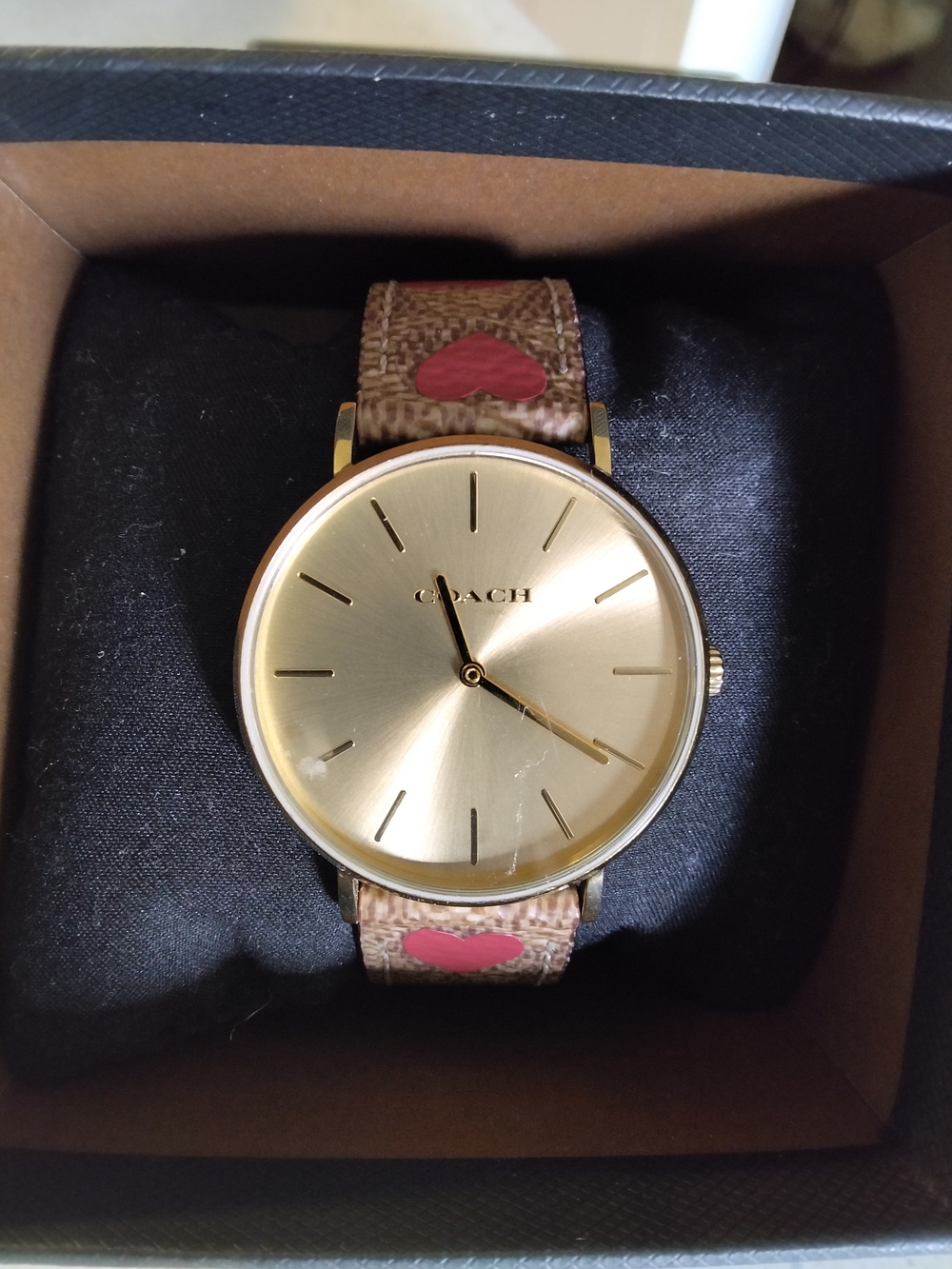 Coach Gold Dial Watch with Brown Signature Strap and Pink Heart Accents